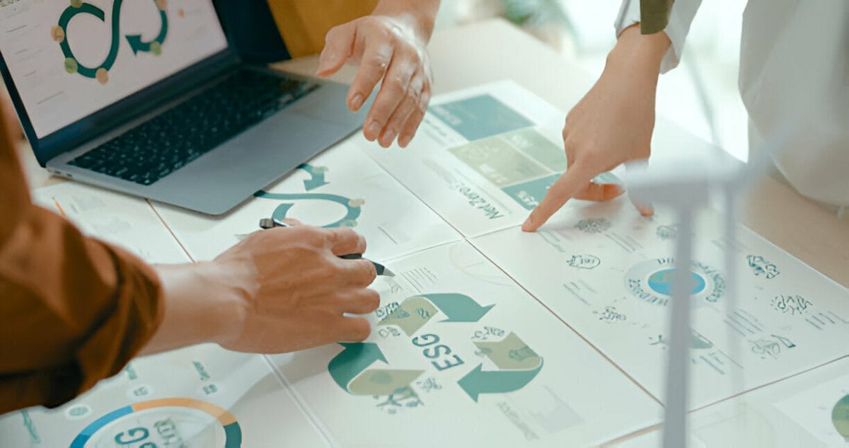 Hands analyzing business charts and graphs