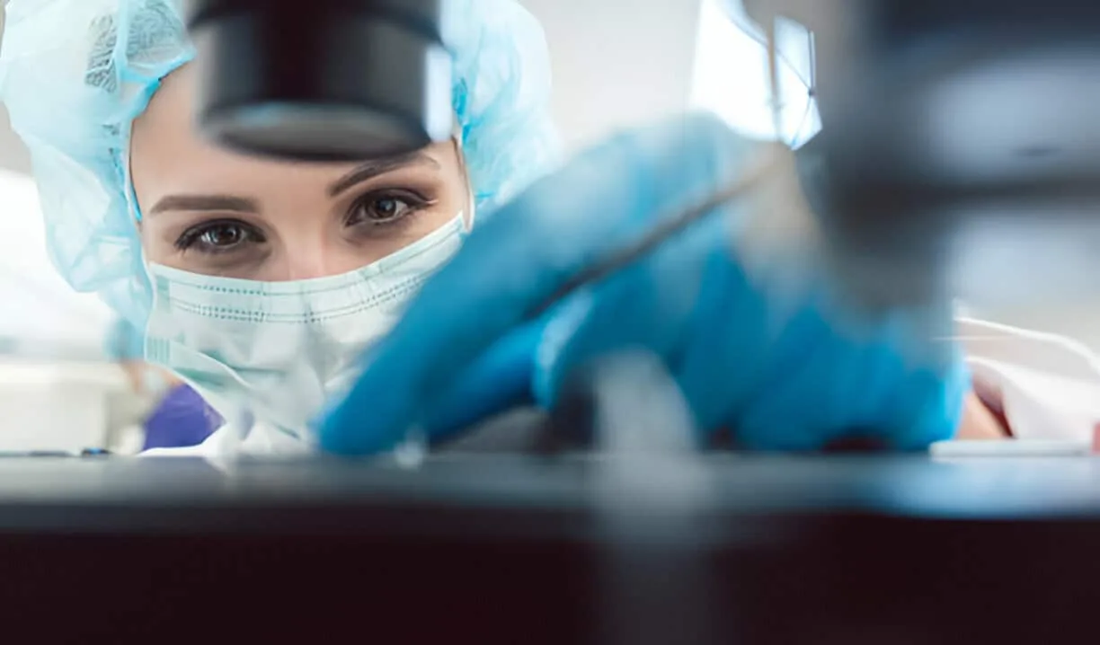 Person working in laboratory setting.