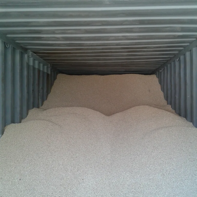 Container filled with loose corn cobs